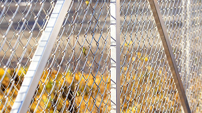 Aluminium supporting posts of a sliding gate with chain link mesh filling