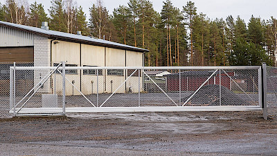 Automatic aluminium sliding gate protecting warehouse property.