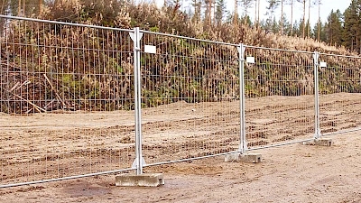 Removable temporary fencing panels with concretes bases.