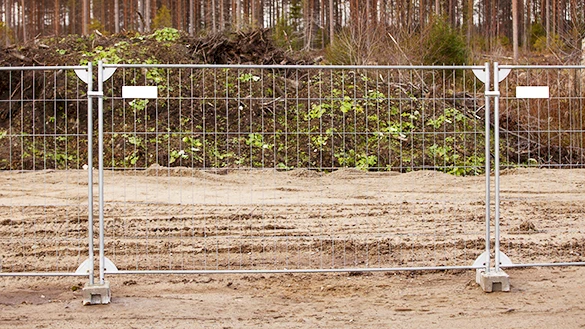 A temporary fence panel with concrete bases.