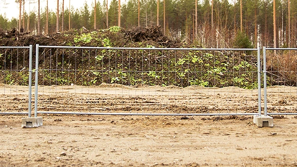 Low temporary fencing panel with two concrete stands.
